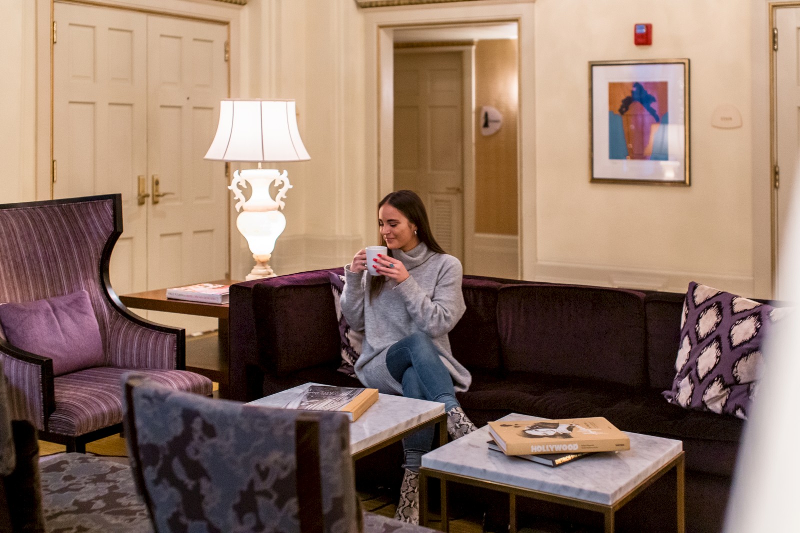 girl drinking tea in lobby
